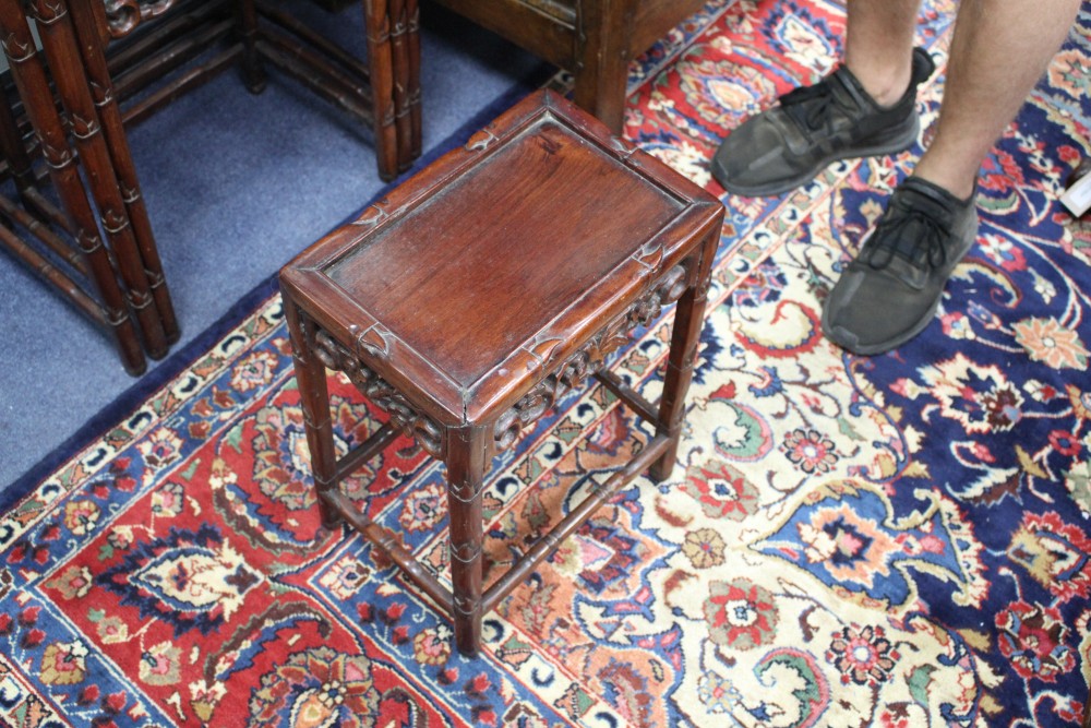 A nest of four 19th century Chinese carved pierced hardwood tables, W.50cm D.36cm H.71cm